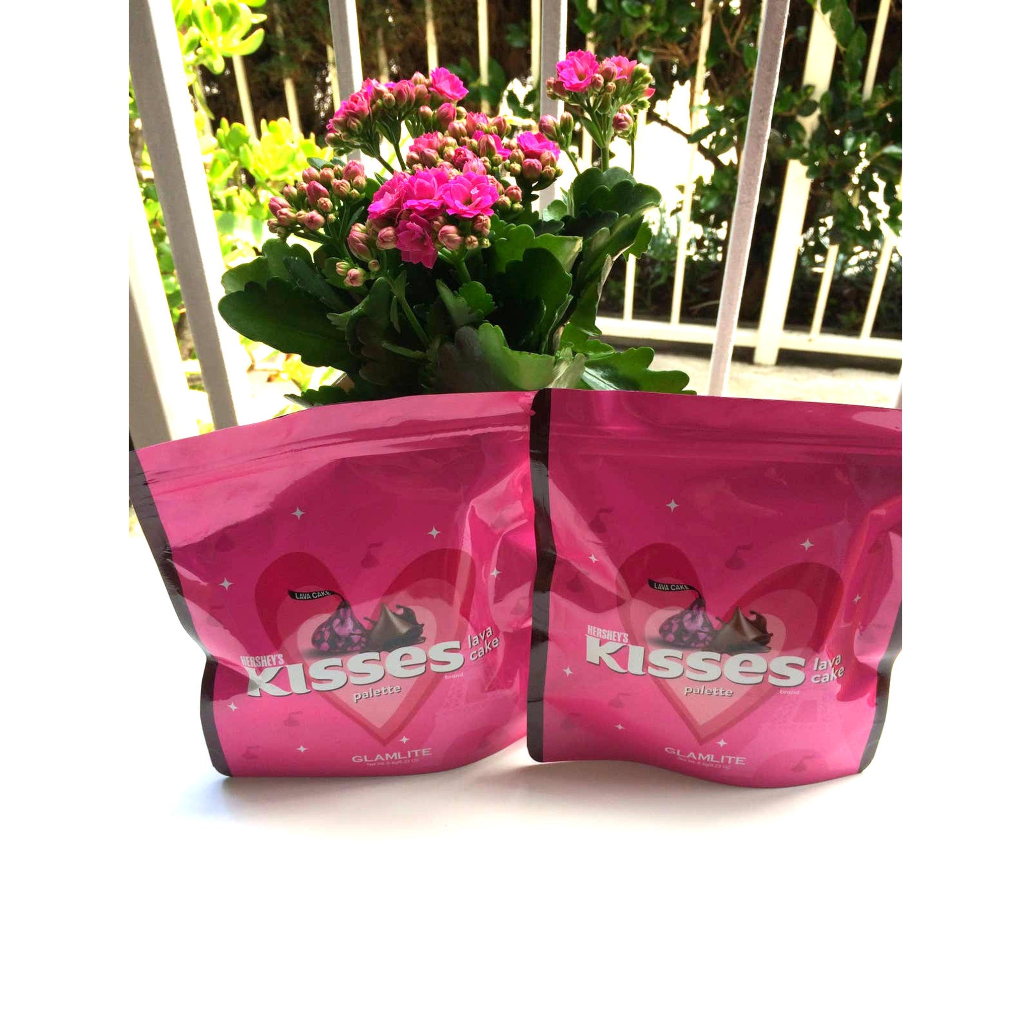 Hershey's Kisses palette in pink packaging with stars and Hershey's Kiss graphic, two bags shown