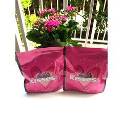 Hershey's Kisses palette in pink packaging with stars and Hershey's Kiss graphic, two bags shown