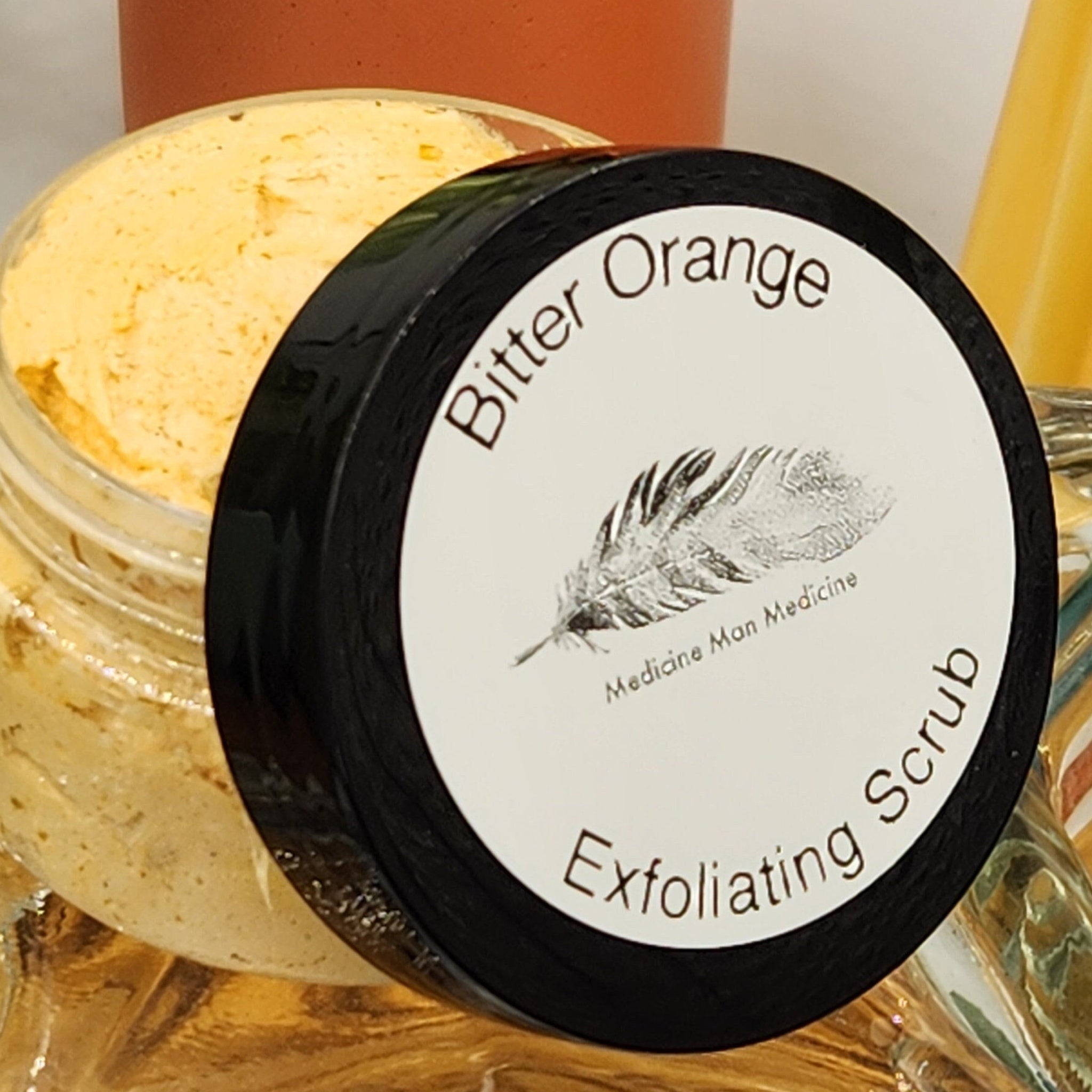 Exfoliating Scrub with yellow granules, black lid, and Medicine Man Medicine label