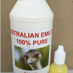 Golden emu oil being gently massaged into clean skin with fingertips for deep hydration
