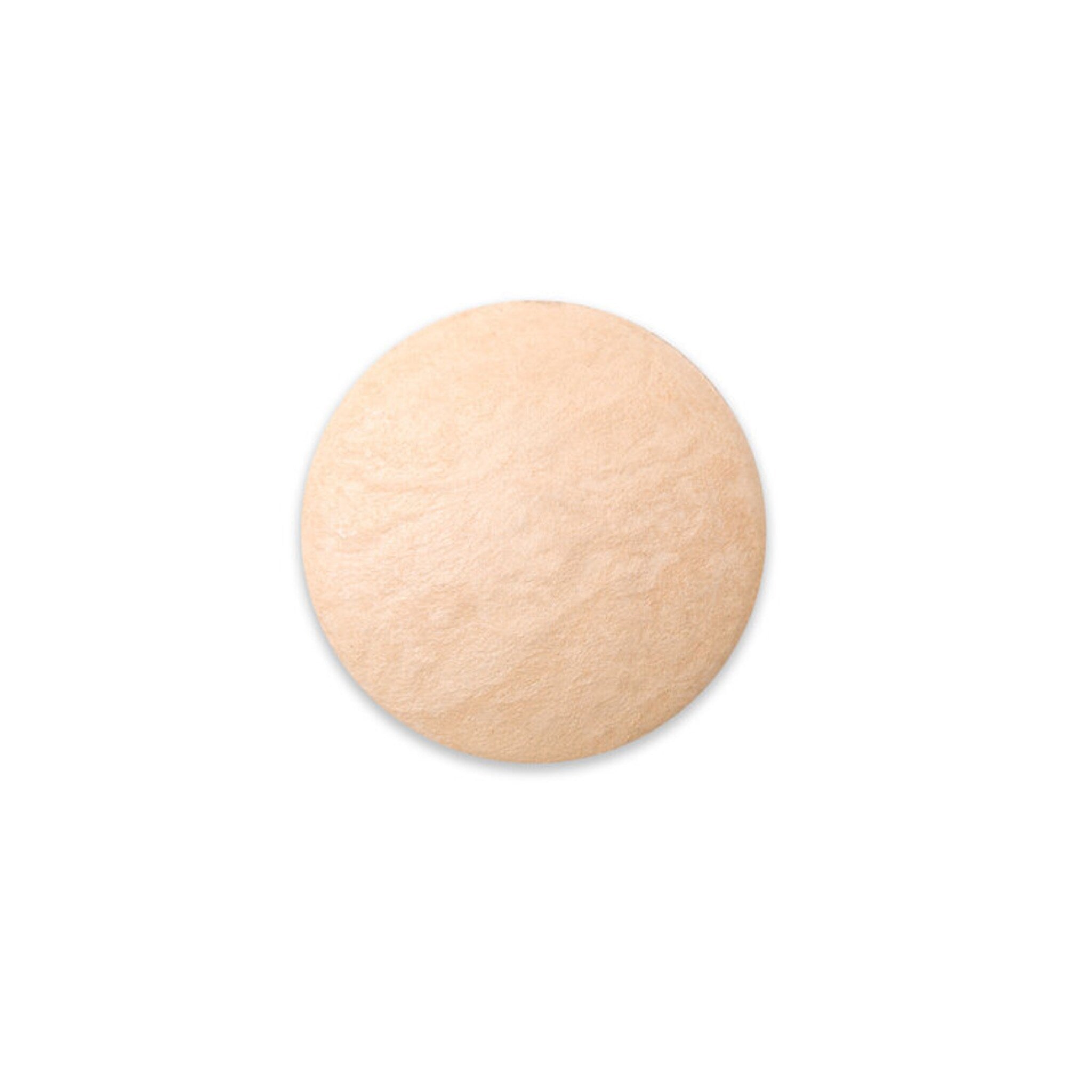 Side view of French Vanilla baked eye shadow pan showing creamy beige powder with subtle shimmer texture