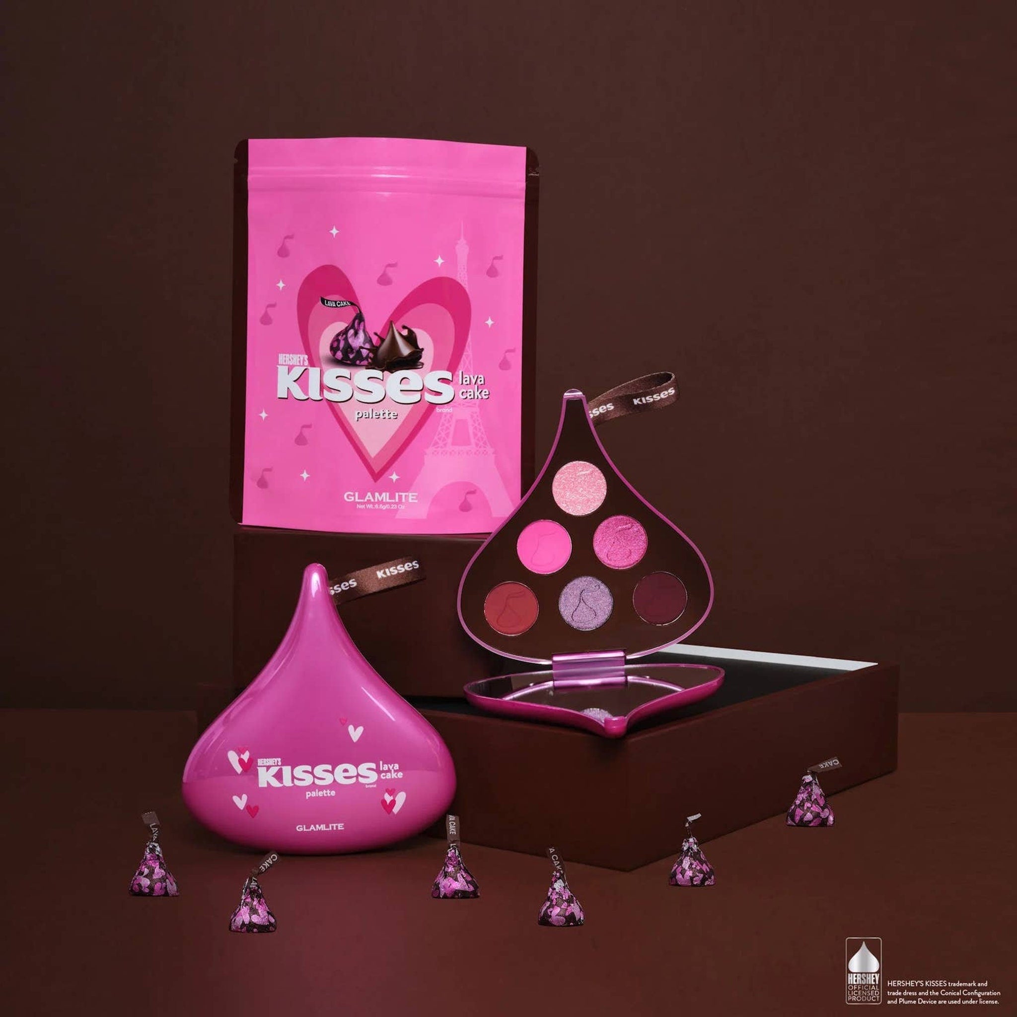 Eyeshadow palette in pink, brown, and purple shades with Hershey's Kisses branding and packaging