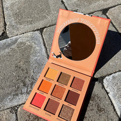 Close-up of the I Heart Revolution Sylvester Looney Tunes eyeshadow palette showing vibrant matte and shimmer shades