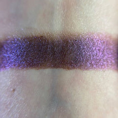 Close-up of Embers Eye Shadow pan showing rich bronze shimmer with smooth satin finish
