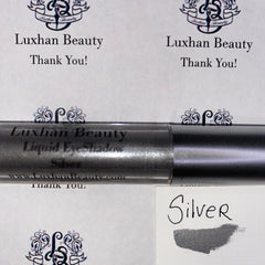 Silver glitter liquid eyeshadow in sleek tube with doe-foot applicator, shimmering metallic finish