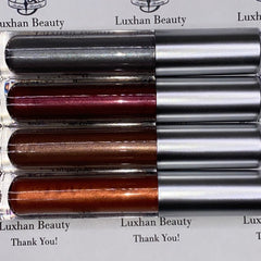 Lip gloss tubes with silver metallic caps and various shades of shimmer, Luxhan Beauty brand