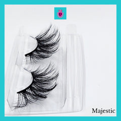 False eyelashes with black synthetic fibers in clear plastic packaging, Majestic brand name visible