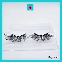False eyelashes, black synthetic lashes in clear plastic packaging, brand name "Majestic" visible.