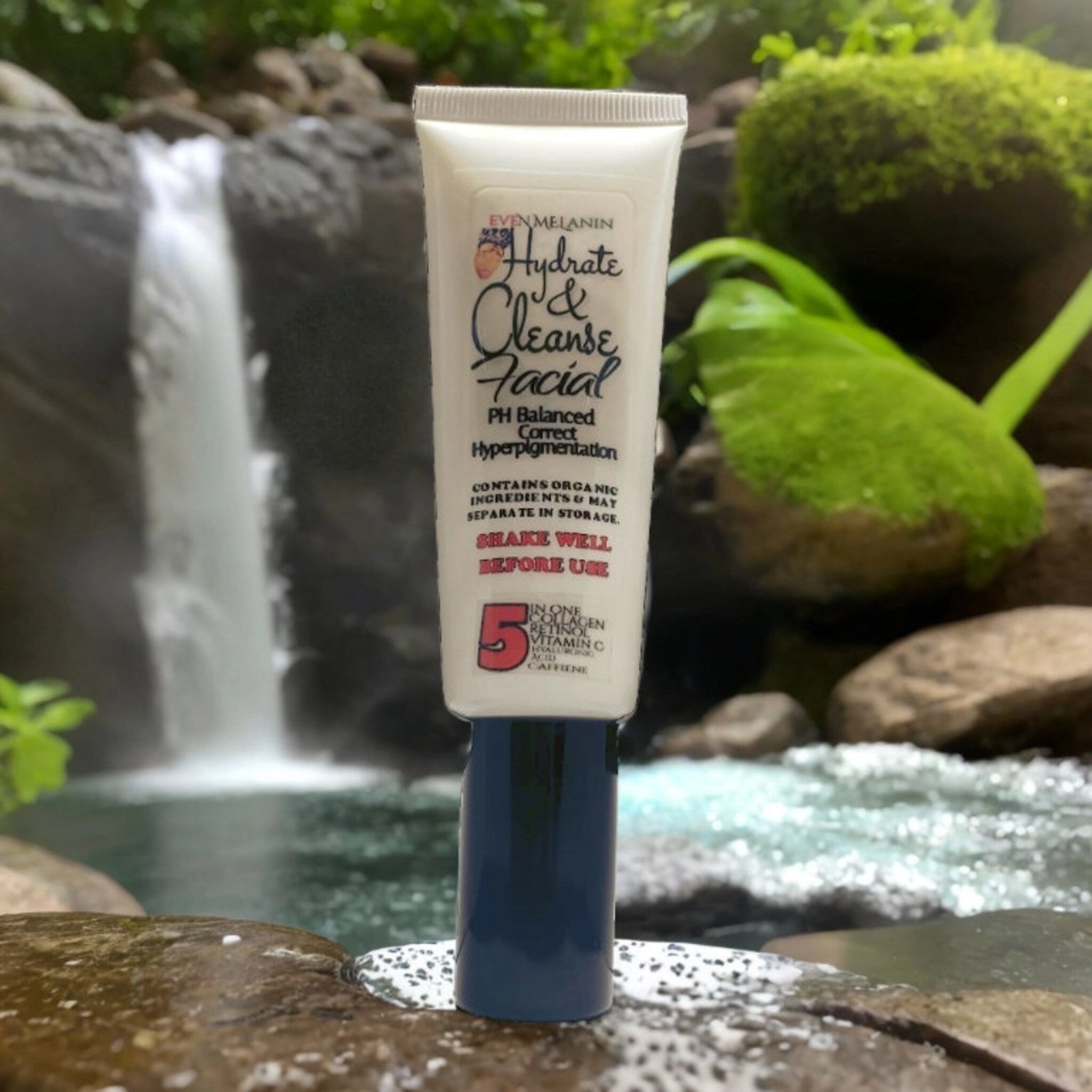 Facial cleanser tube, white and blue container, Even Melanin brand name visible, in natural setting
