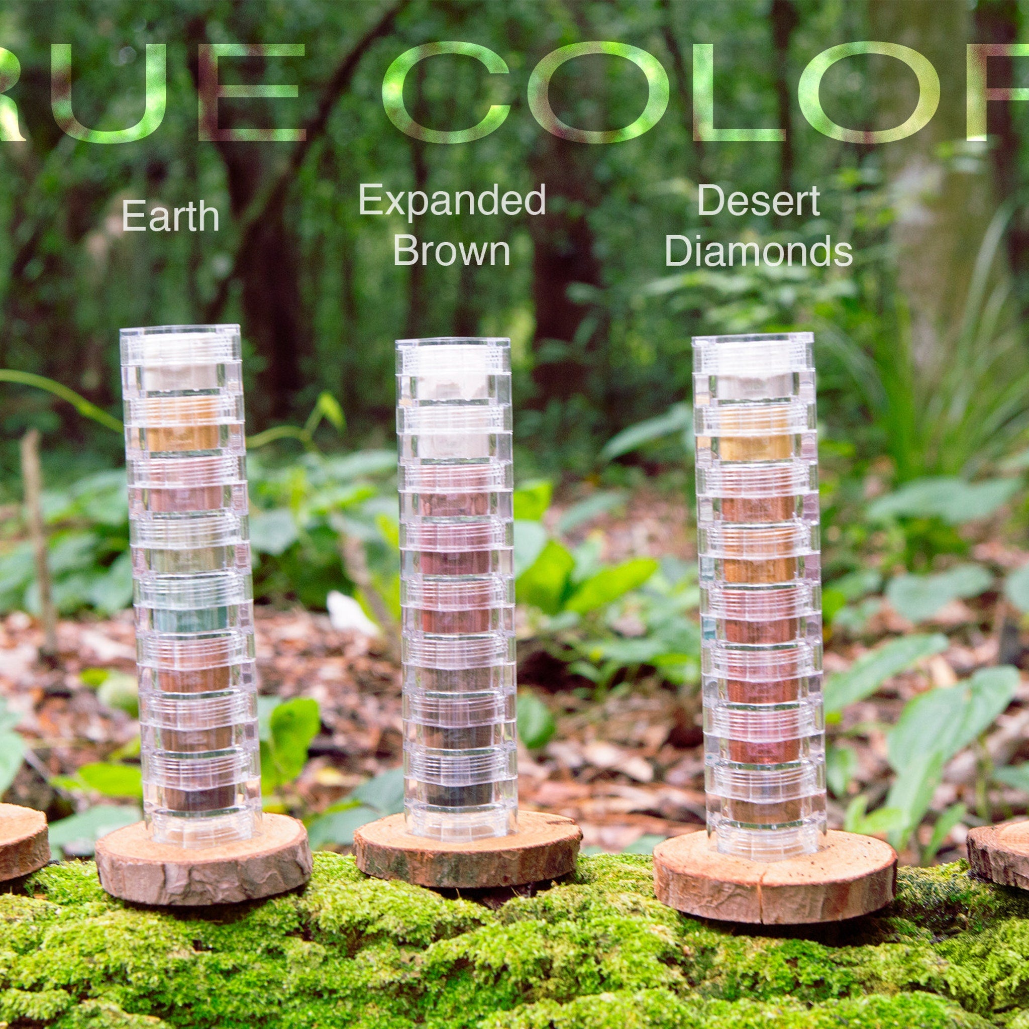 Stacked clear plastic containers with various earth-toned colors on wood slices