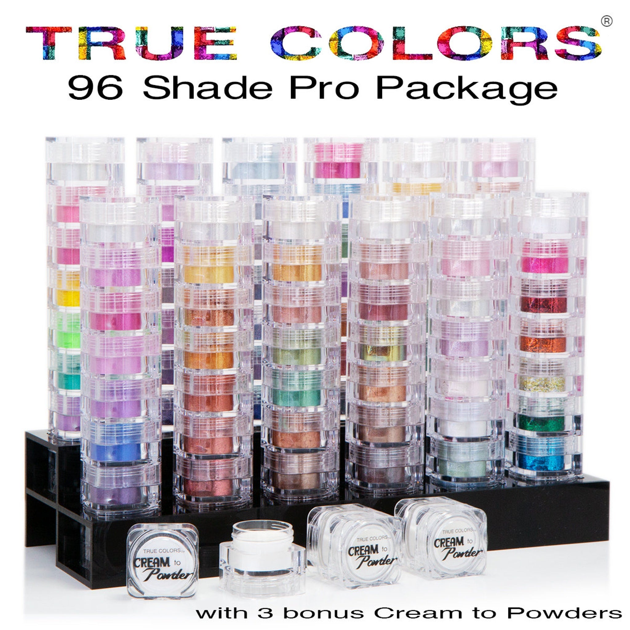 Makeup palette with colorful powder in clear plastic containers, "TRUE COLORS" text visible, includes bonus cream to powder products