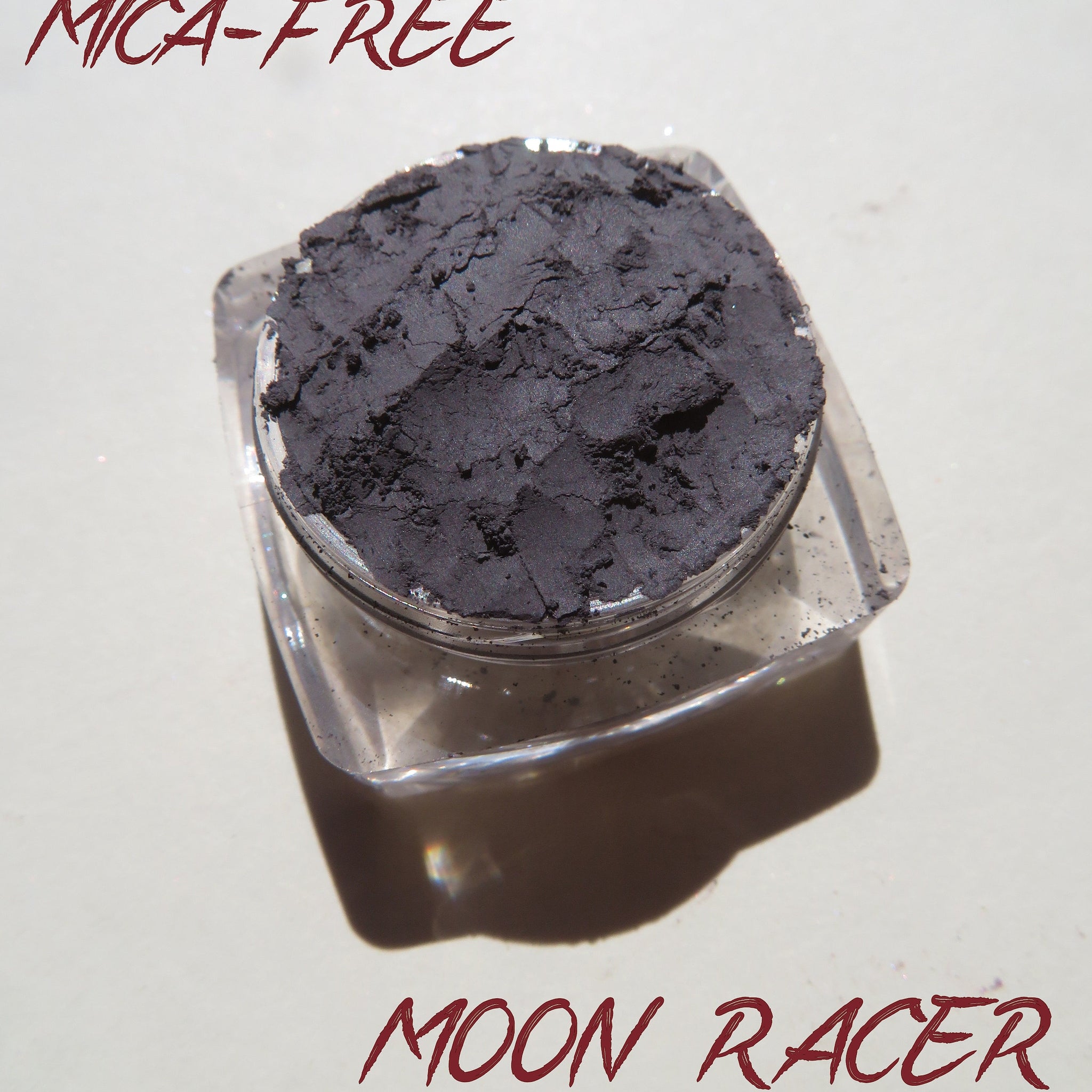 Eye shadow in dark gray, matte finish, in a clear plastic container, Mica-Free Moon Racer