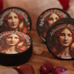 Lip balm containers with Aphrodite's Lip Balm text, black rim, woman illustration, Merakii brand