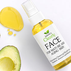Facial cleanser bottle with yellow liquid, white label, and Clearly FACE brand text