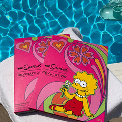 Eyeshadow palette, pink cardboard box, Lisa Simpson graphic, Makeup Revolution brand