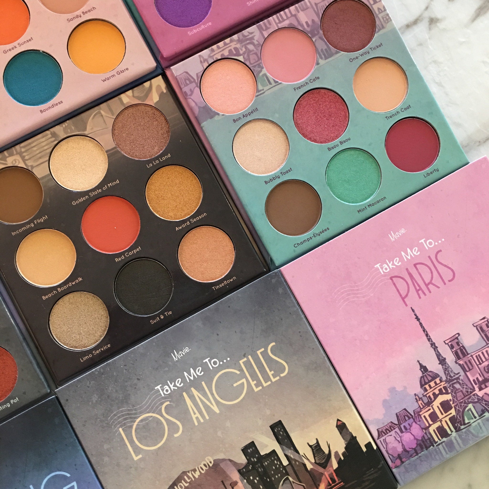 Eyeshadow palettes with various colors, Mavie brand packaging, for makeup application