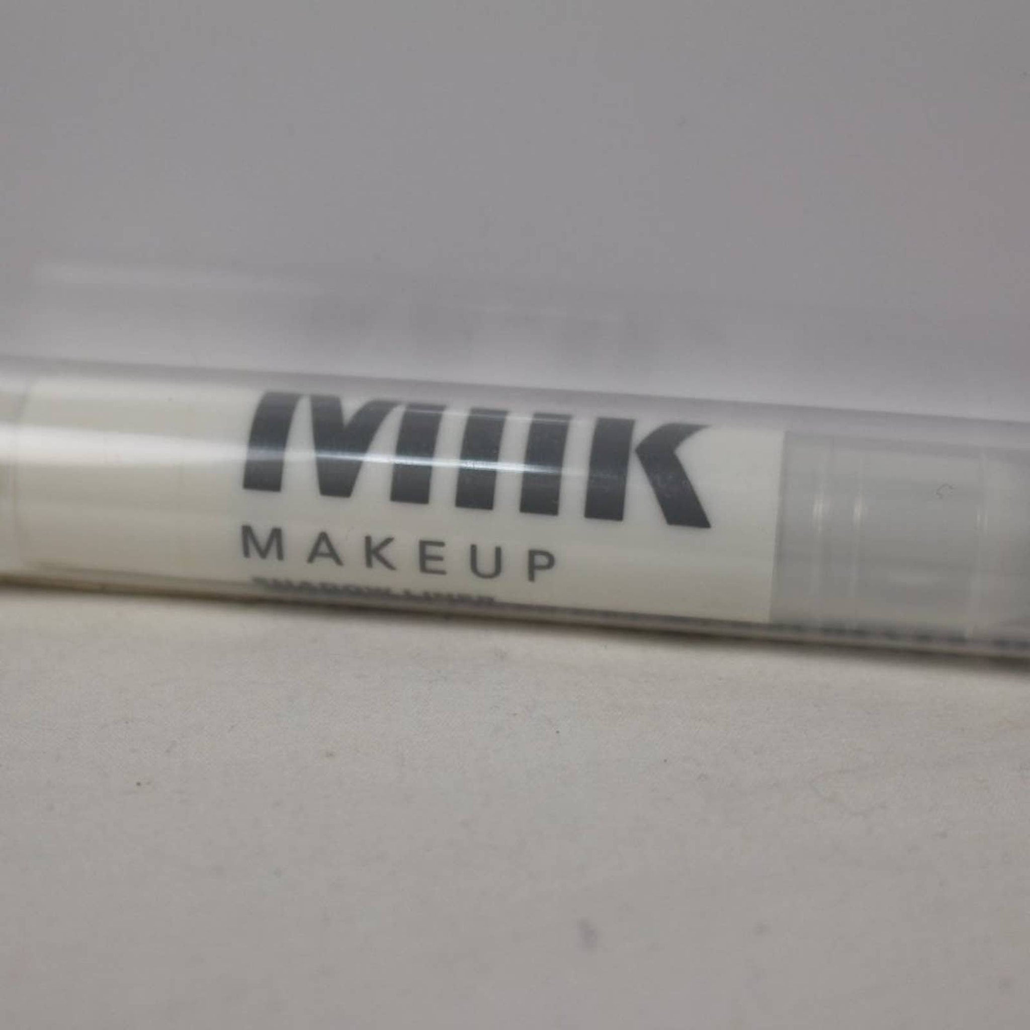 Front view of Milk Makeup Eye Shadow in sleek black compact with mirrored lid and brand logo