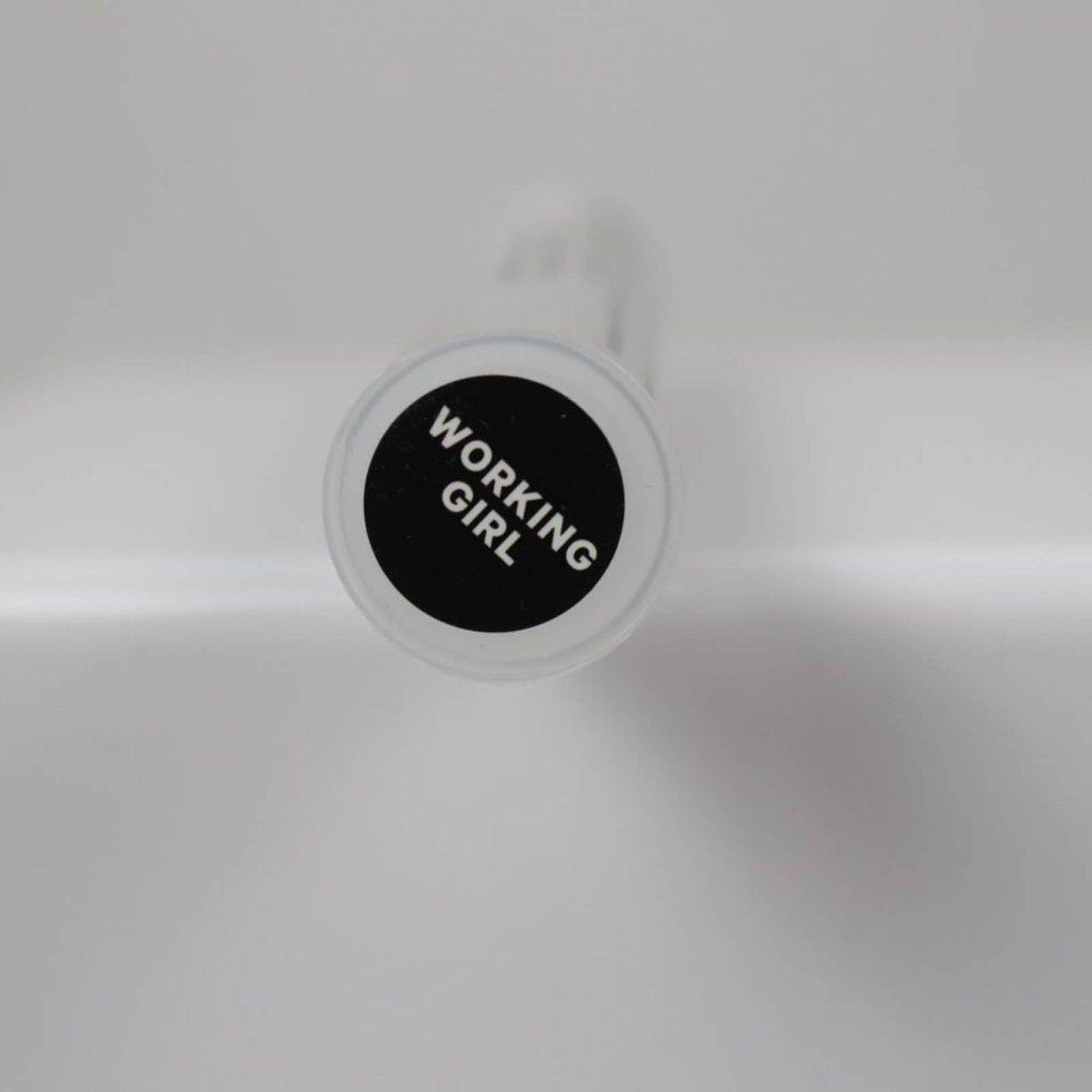 Side view of Milk Makeup Eye Shadow compact showing sleek black packaging and pressed powder texture