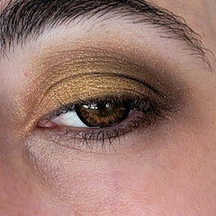 Side view of Copper Penny eye shadow pan showing rich metallic copper pigment and smooth pressed texture
