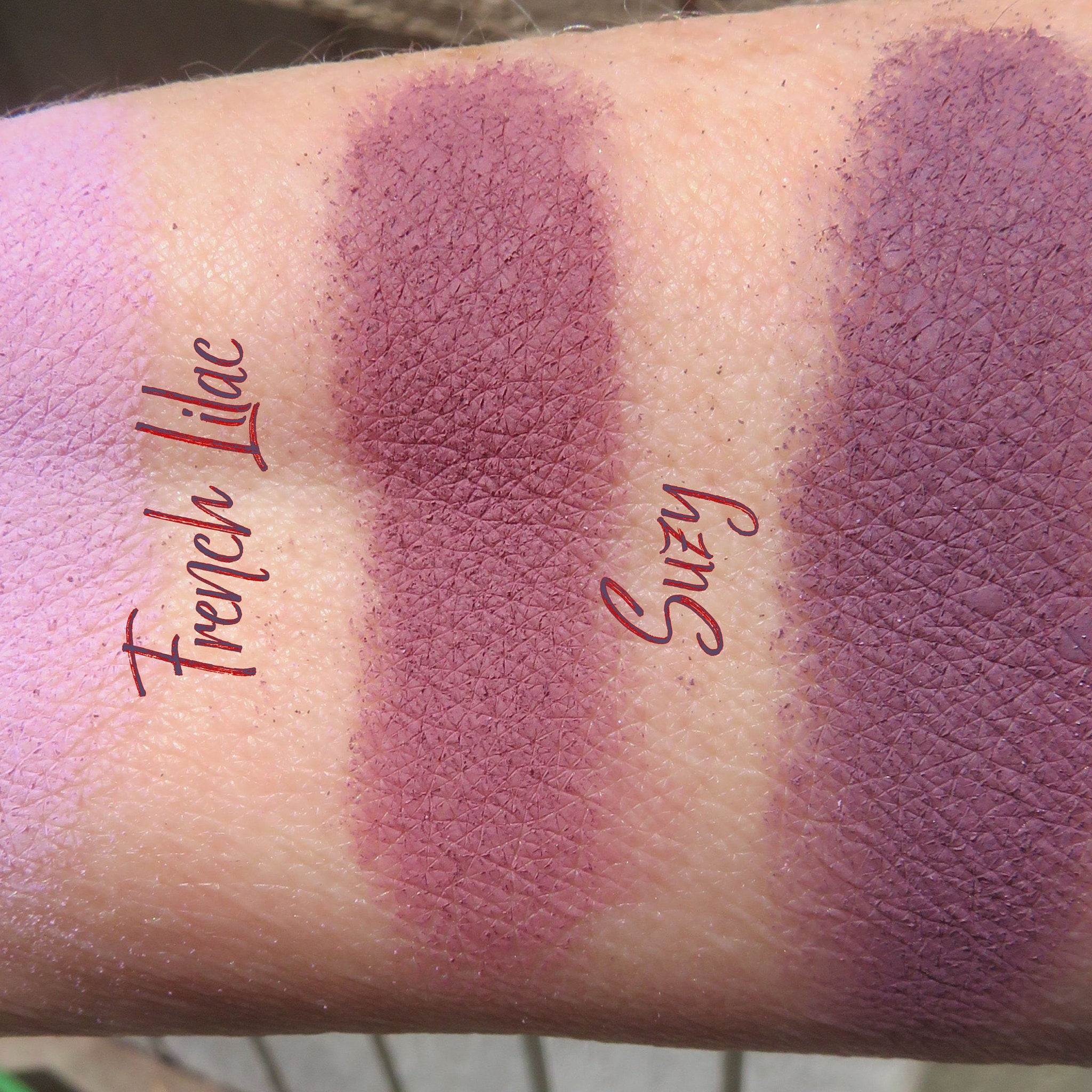 Side view of matte purple mineral eyeshadow set showing loose powder texture in vegan-friendly packaging
