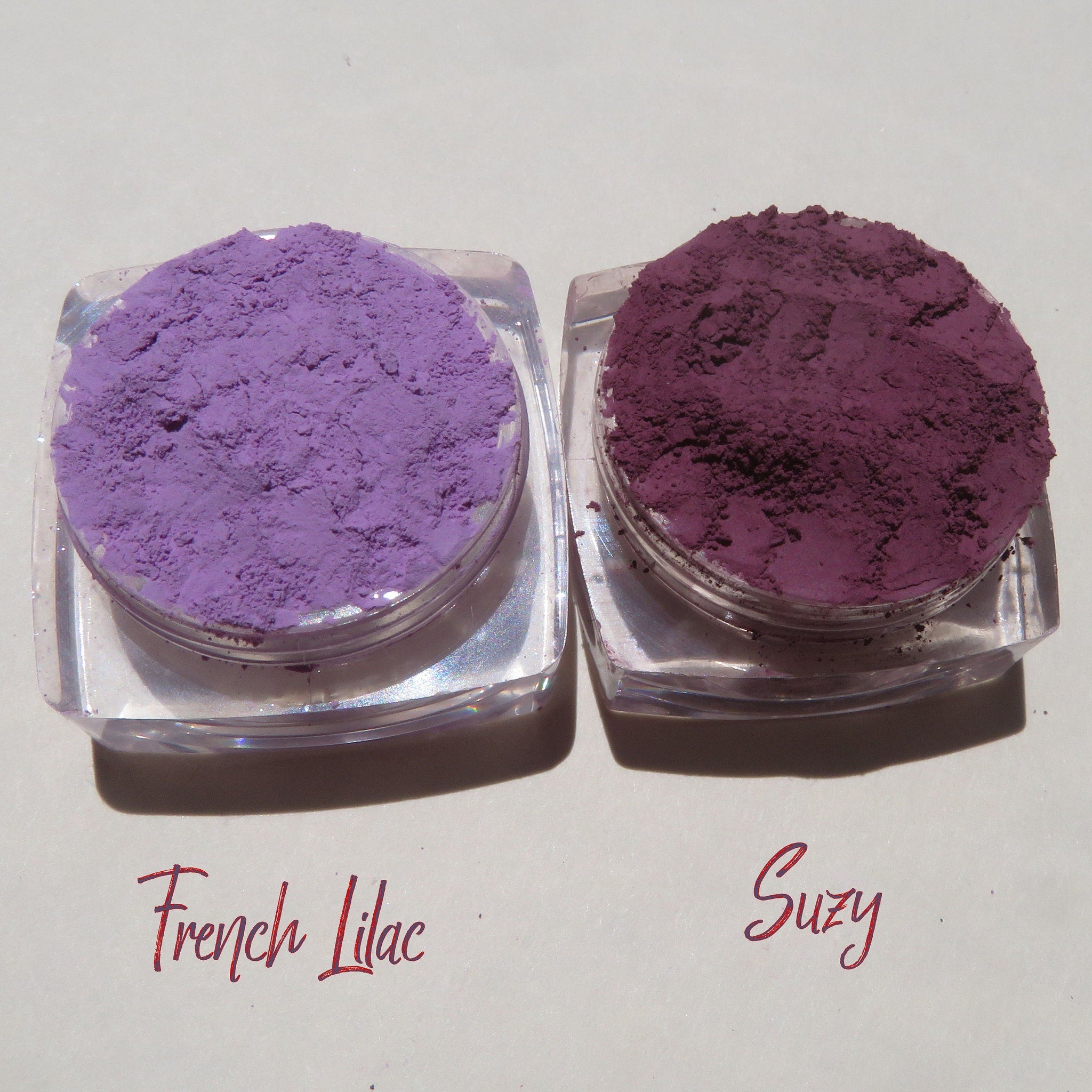 Purple mineral eyeshadow set in matte finish, displayed in sleek eco-friendly packaging with vegan certification label