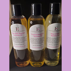 Burning oil bottles with black caps, clear glass, and E-SCENTUAL NATURAL PRODUCTS labels