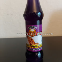 Purple bottle with INDLOVU label, white and purple label with text, sitting on a glossy surface