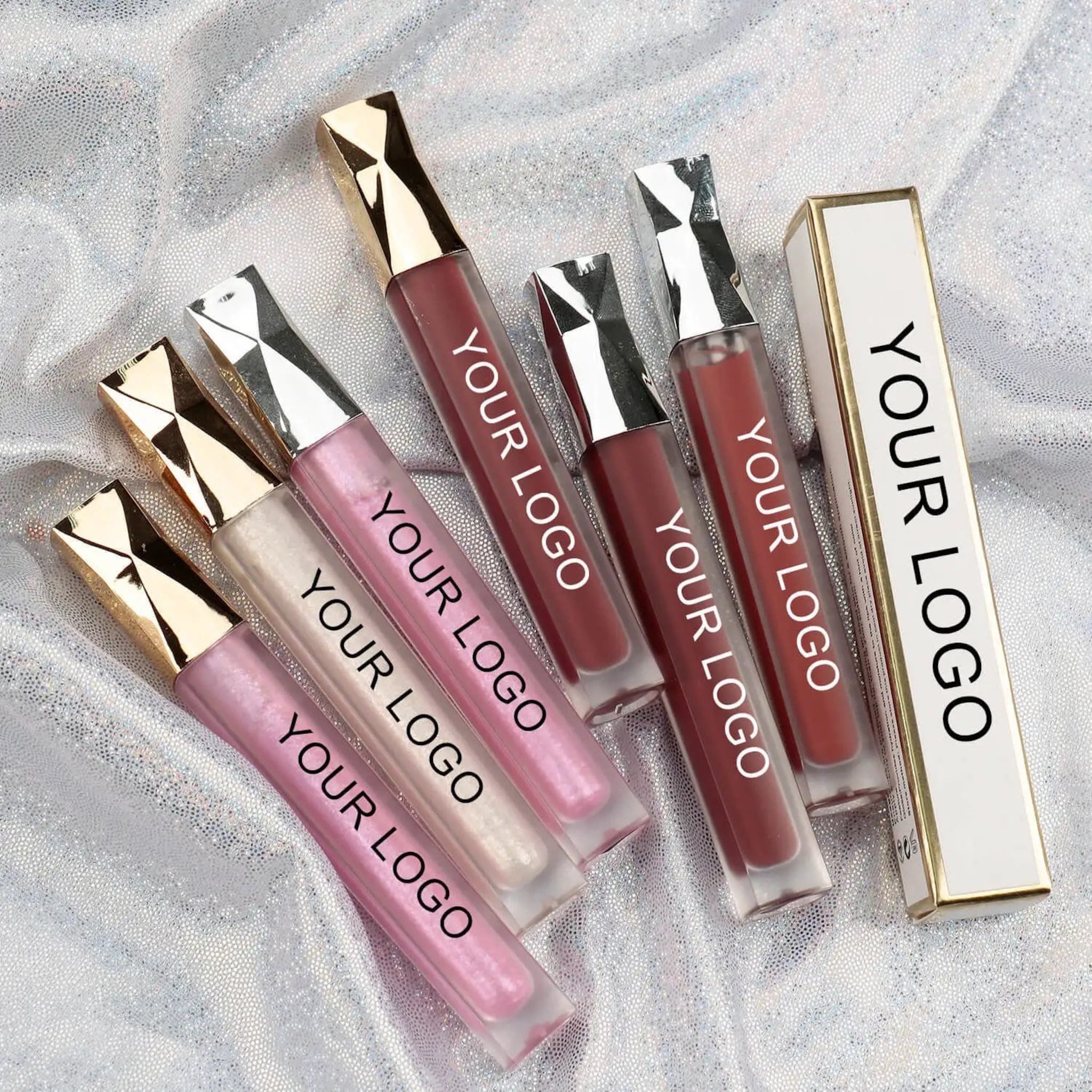 Lip gloss tubes with gold and silver caps, various colors, and "YOUR LOGO" printed on tubes and box