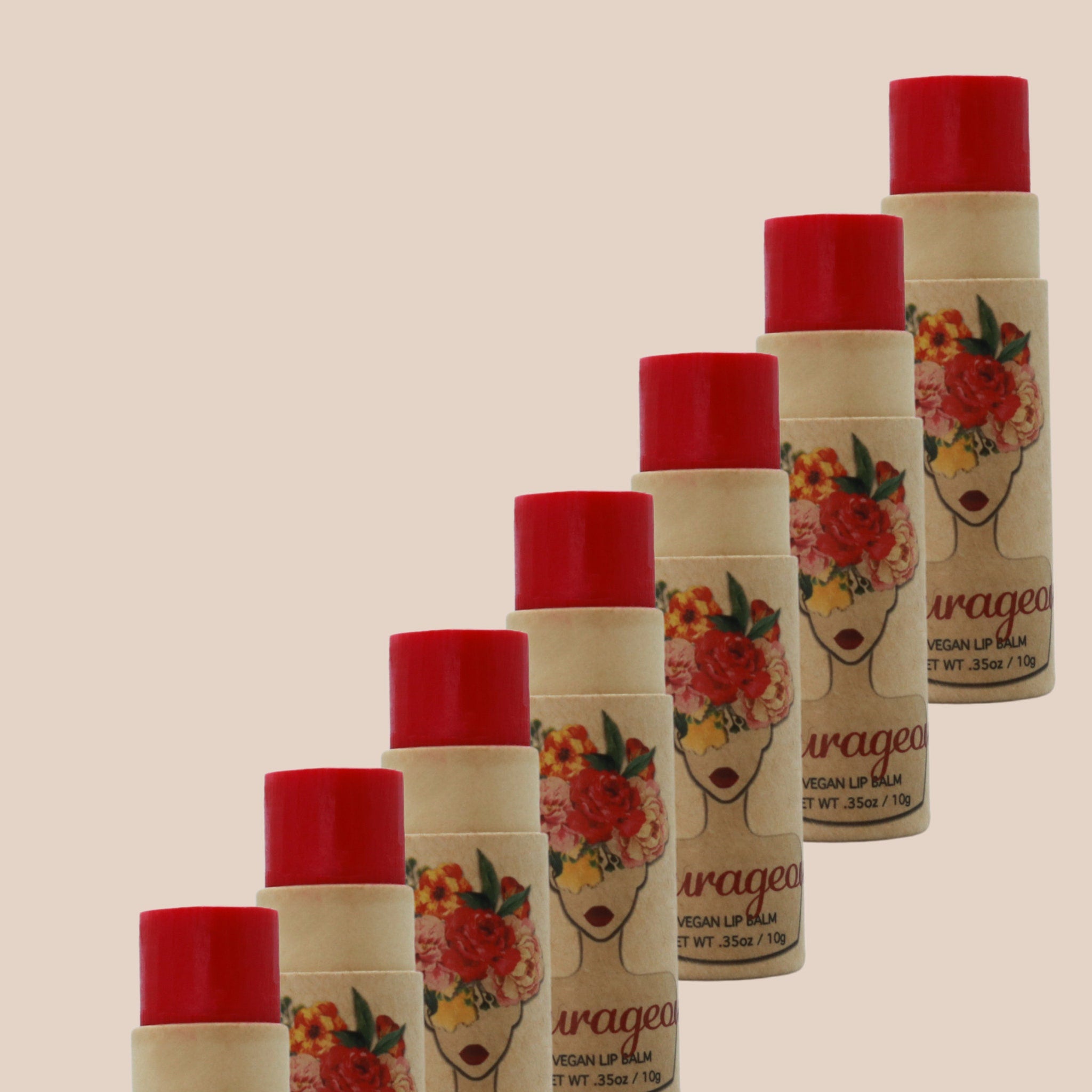 Lip balm tubes with red tops, floral print, and "urageo" text visible on packaging
