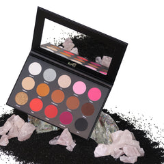 Eyeshadow palette with multiple colors, black case, and mirror reflection with "A" logo visible