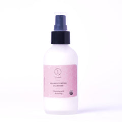 Facial cleanser bottle, white frosted glass, black pump top, pink label with Lizush text