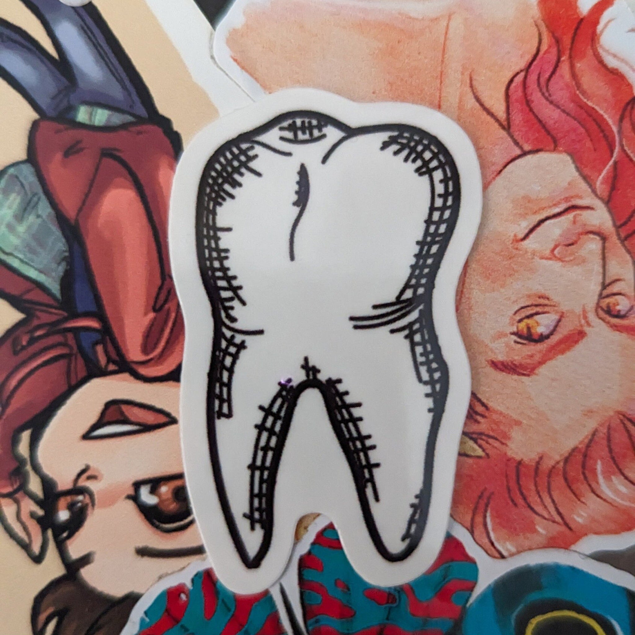 Close-up of realistic temporary tooth tattoo on skin with detailed enamel texture and subtle shading