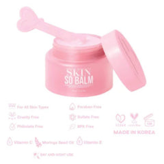 Skin balm jar with pink color, lid, and heart-shaped applicator, Skin So Balm branding visible