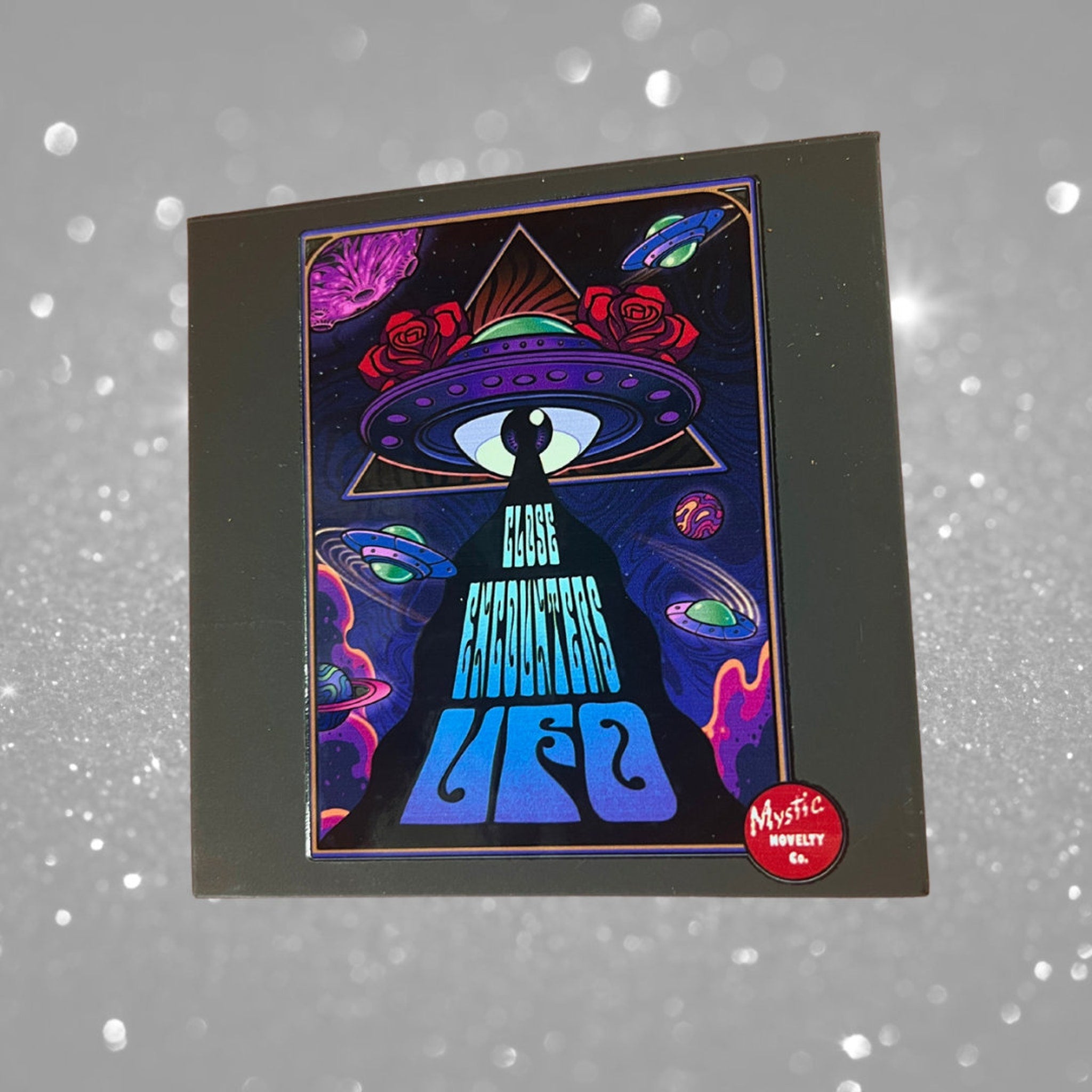 UFO art print with colorful illustration, "Close Encounters" text, and Mystic Novelty Co. logo on black frame