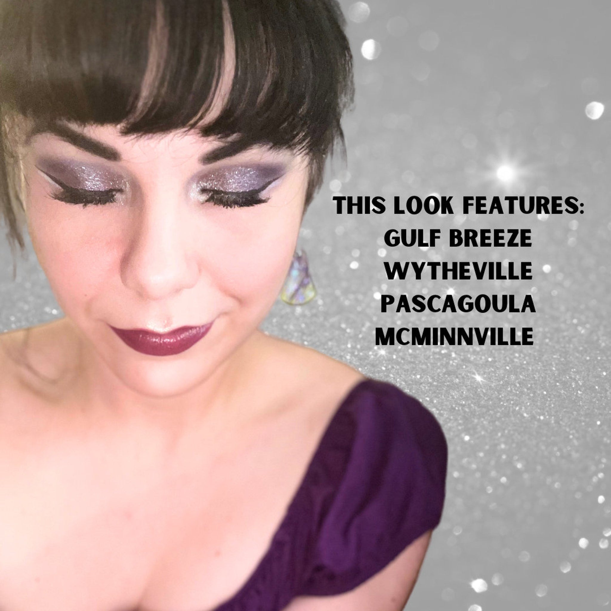 Eyeshadow look with silver glitter, dark purple lip color, and dark bangs hairstyle