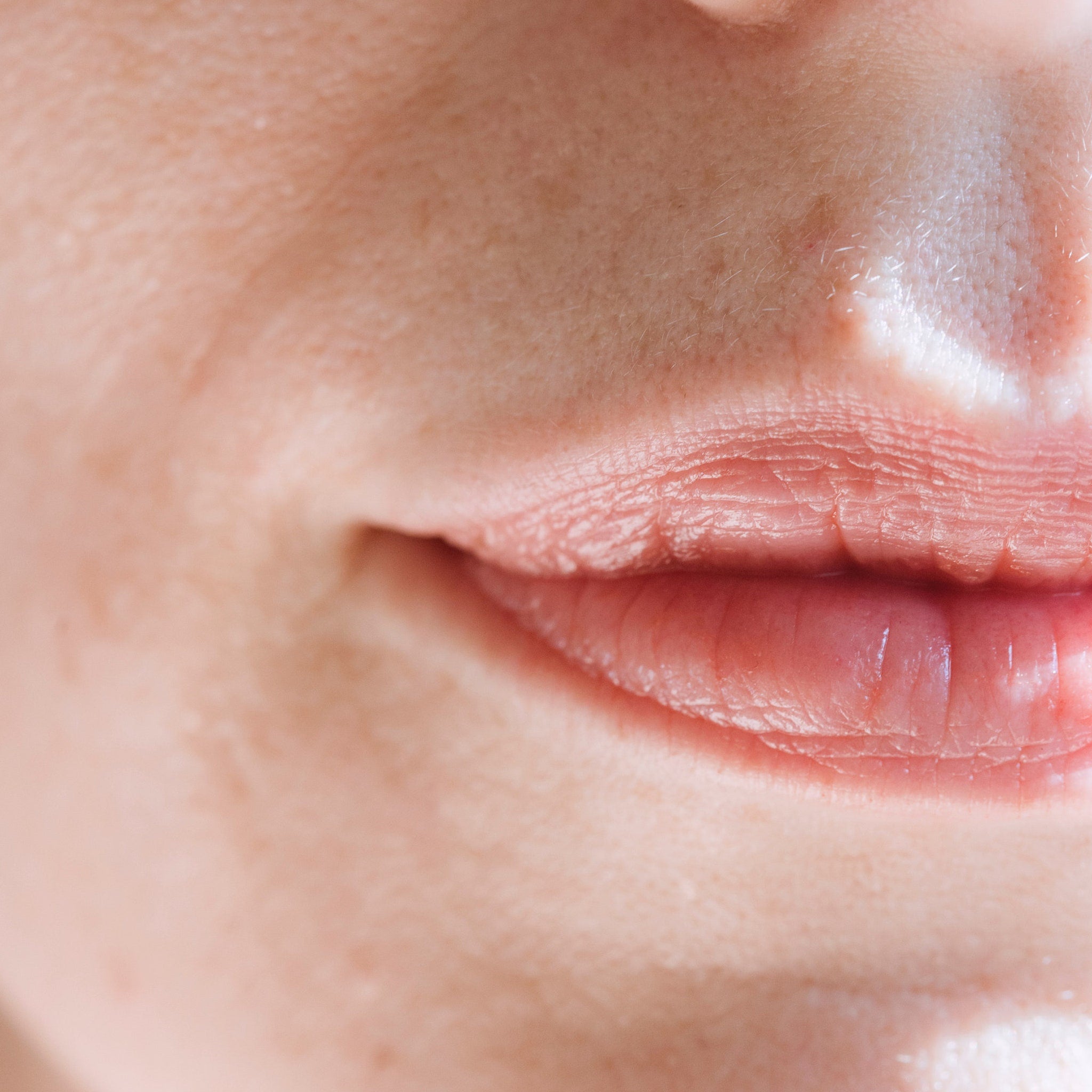 Lips close-up, pink skin, textured lips, showing mouth detail