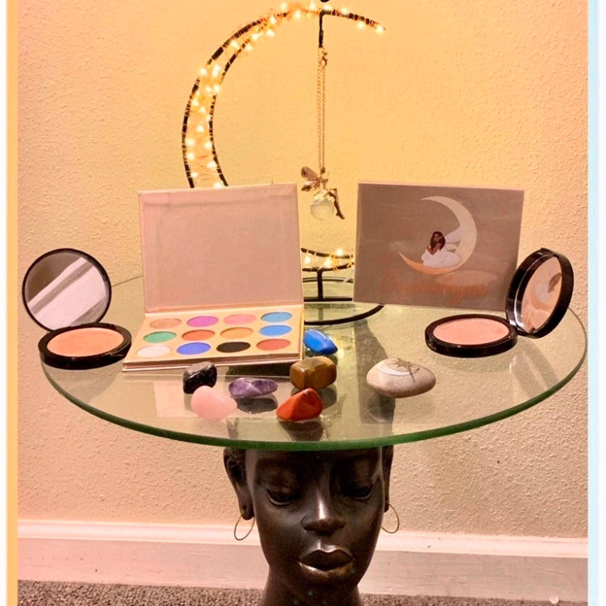 Side view of Painted Fairy Crystal Eyes palette showing shimmer shadows in pink, gold, and bronze hues