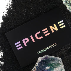 Eyeshadow palette, black rectangular case with iridescent text, "EPICENE" and "EYESHADOW PALETTE
