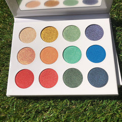 Fairy Dust Palette featuring six shimmering eye shadows in pink, gold, and lavender hues with mirrored compact