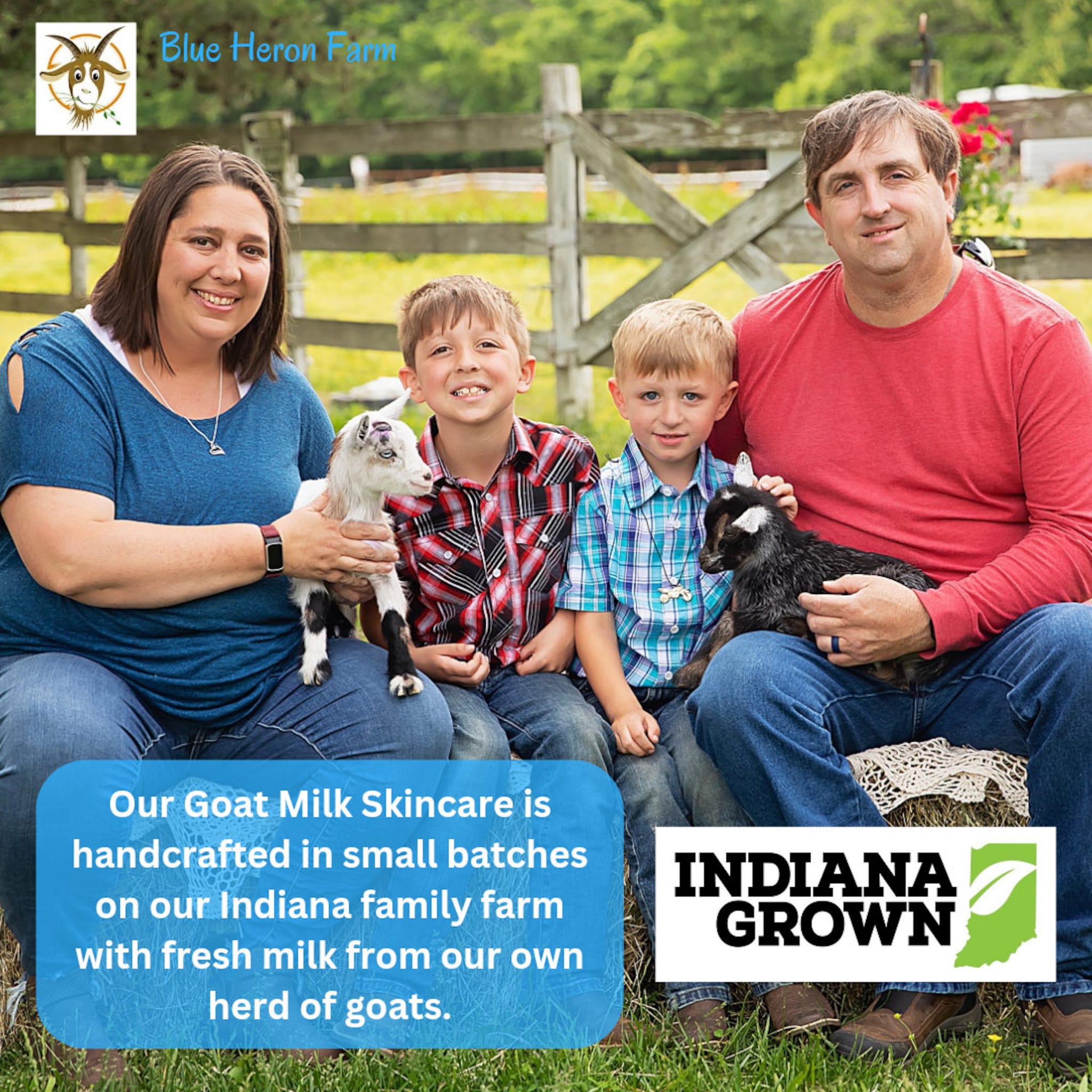 Blue Heron Farm family with goats, wearing plaid shirts and jeans, in front of a wooden fence