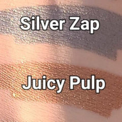 Close-up of Juicy Pulp pressed eye shadow showing vibrant pigment and smooth satin finish in compact case