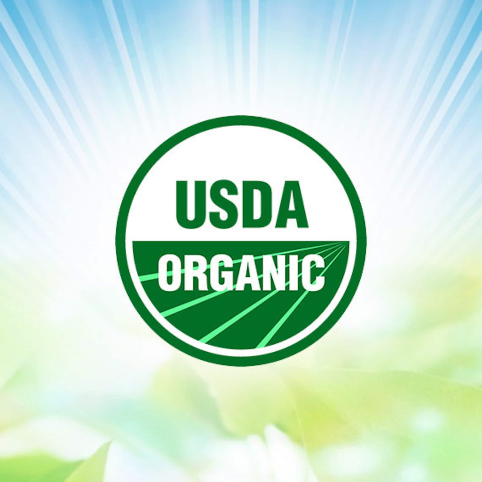 USDA Organic seal, green and white text, circular design with green lines, on a gradient background