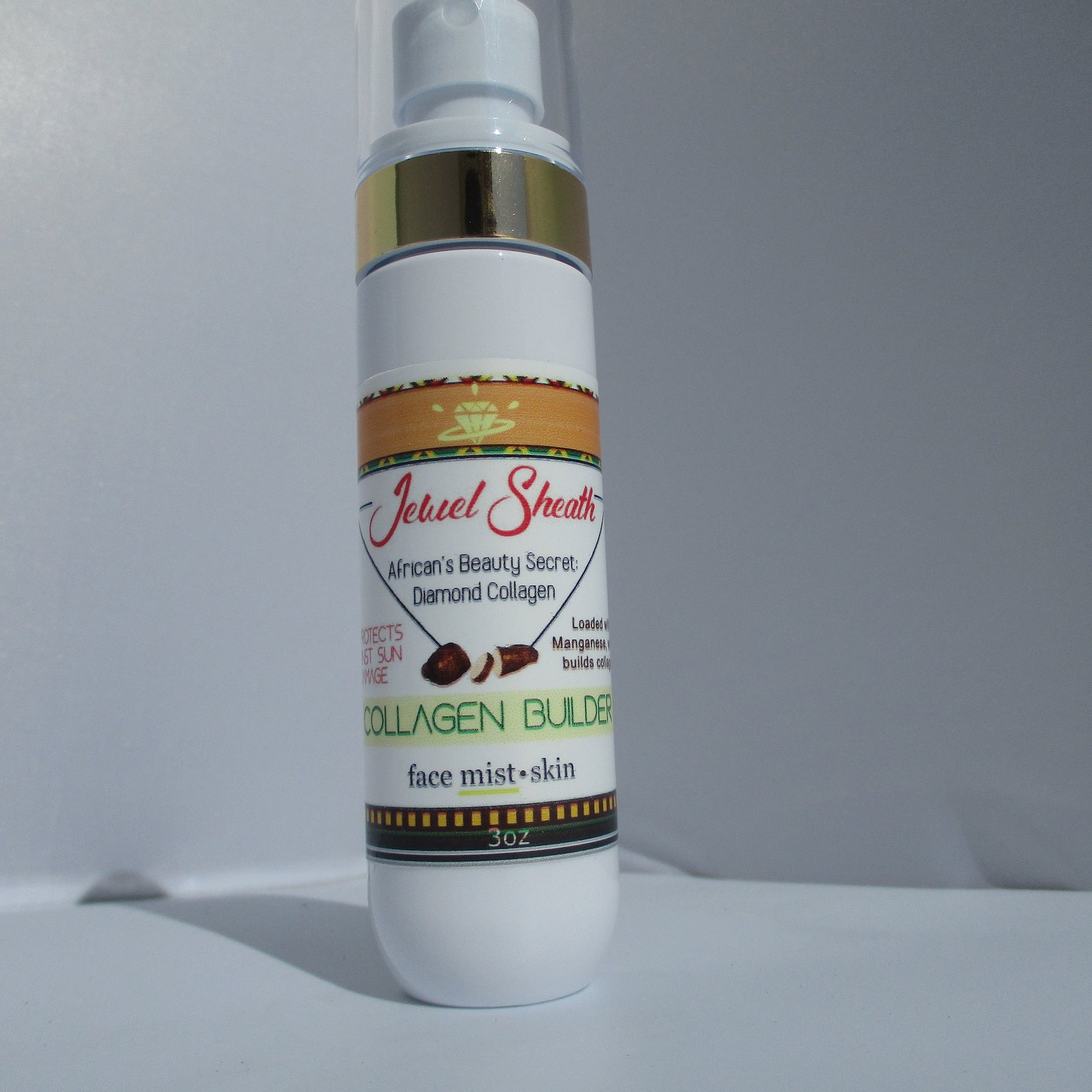 Face mist bottle with white, gold, and brown label, Jewel Sheath brand