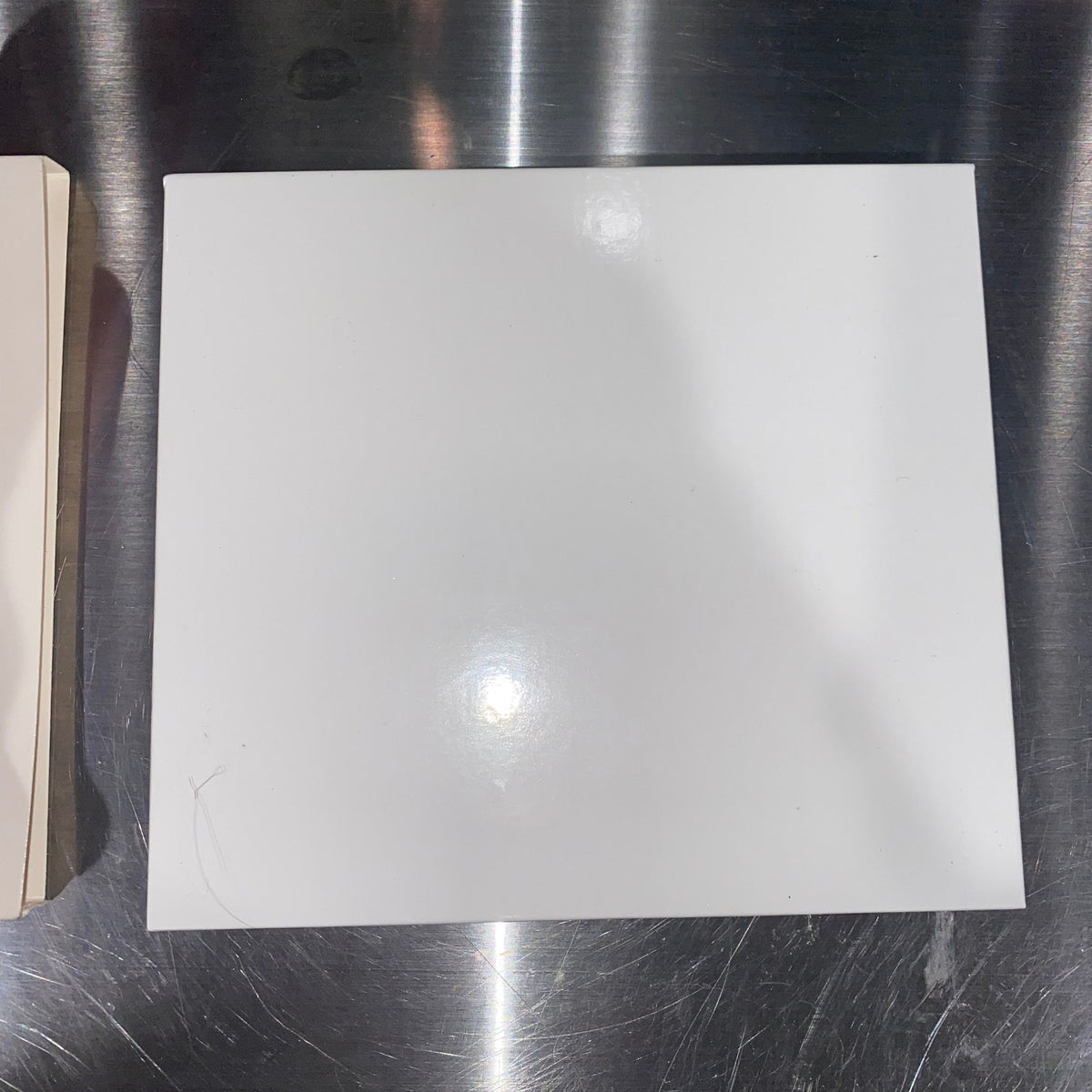 Open rectangular palette with 11 vibrant eyeshadow pans and a large mirror inside