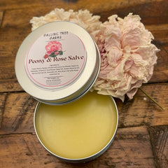Peony & Rose Salve in metal tin, yellow balm, with Fallingtree Farms label and pink flower