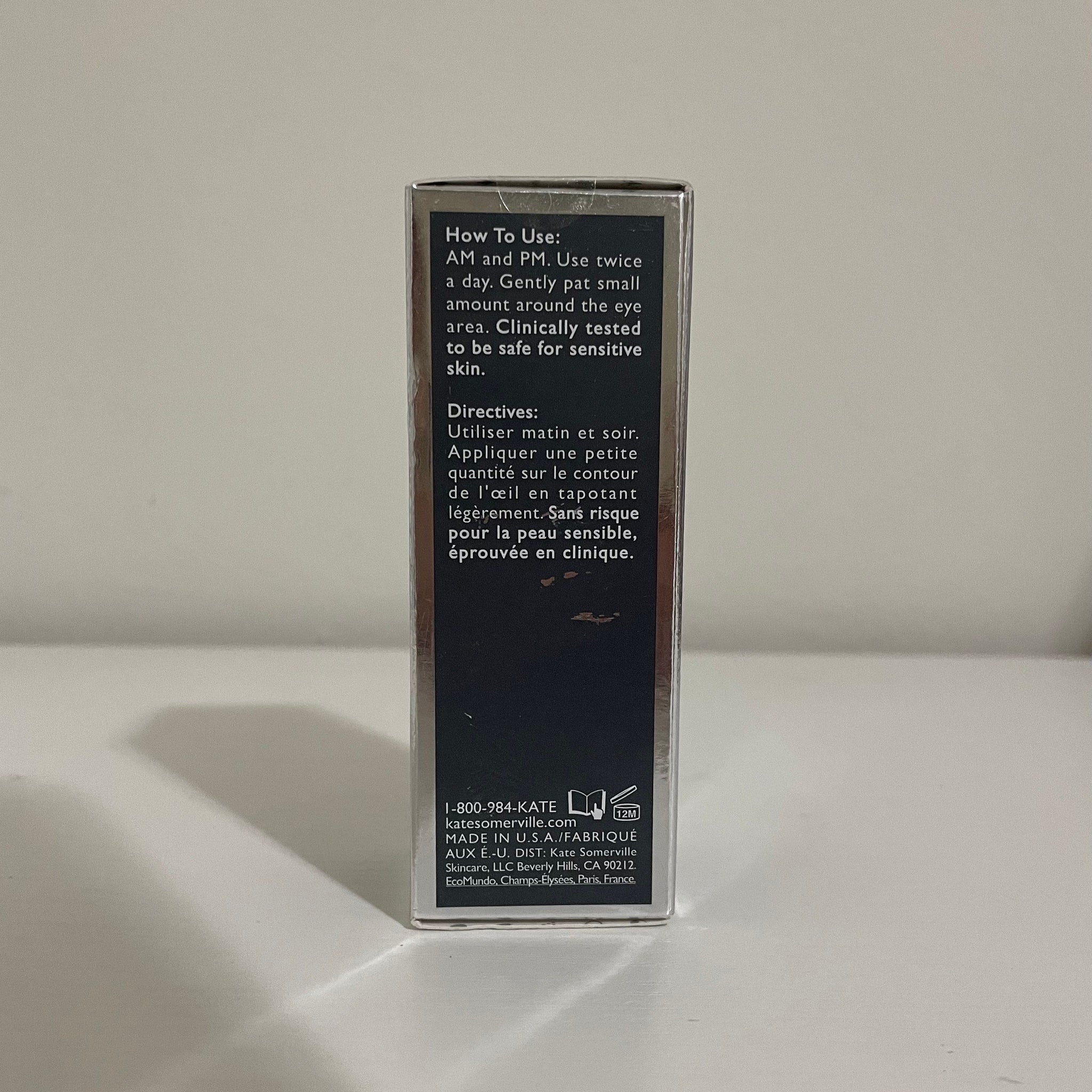 Kate Somerville product box with silver and black design, text visible on the front