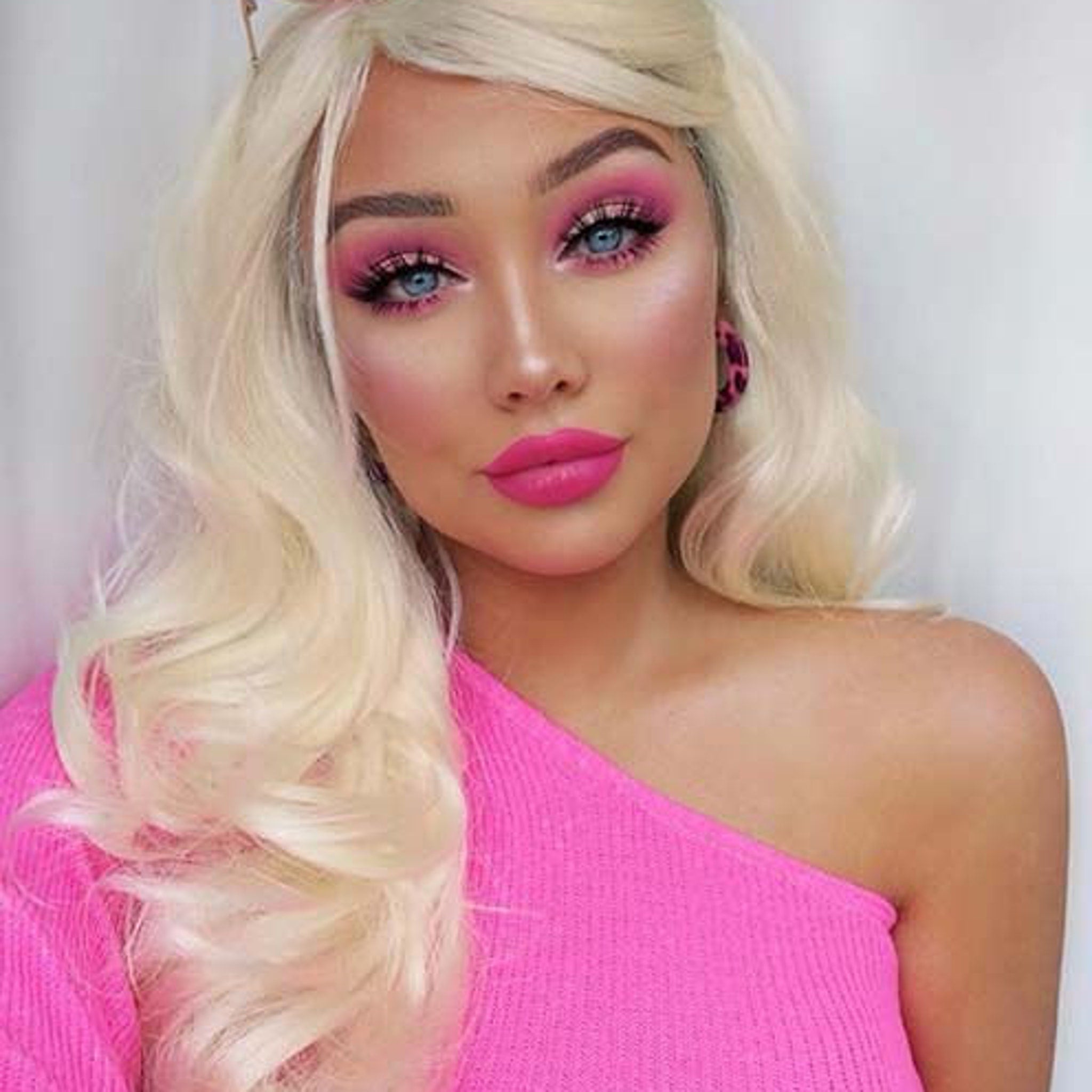 Barbie Pink Vegan Eyeshadow Kit open with sparkly shades displayed in sleek pink compact case