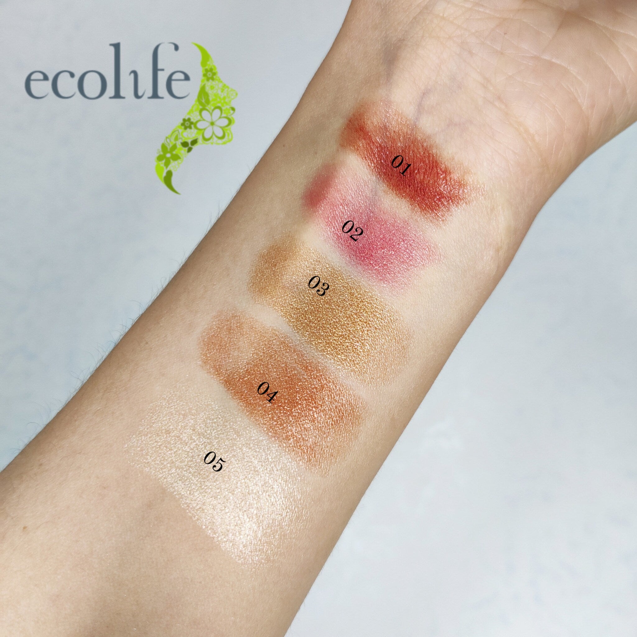 Lipstick swatches in red, pink, gold, and white shades on arm, ecolife logo visible