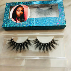False eyelashes with black lashes in clear plastic packaging and blue glitter box, Alilashitique & Bossi Thangz brand