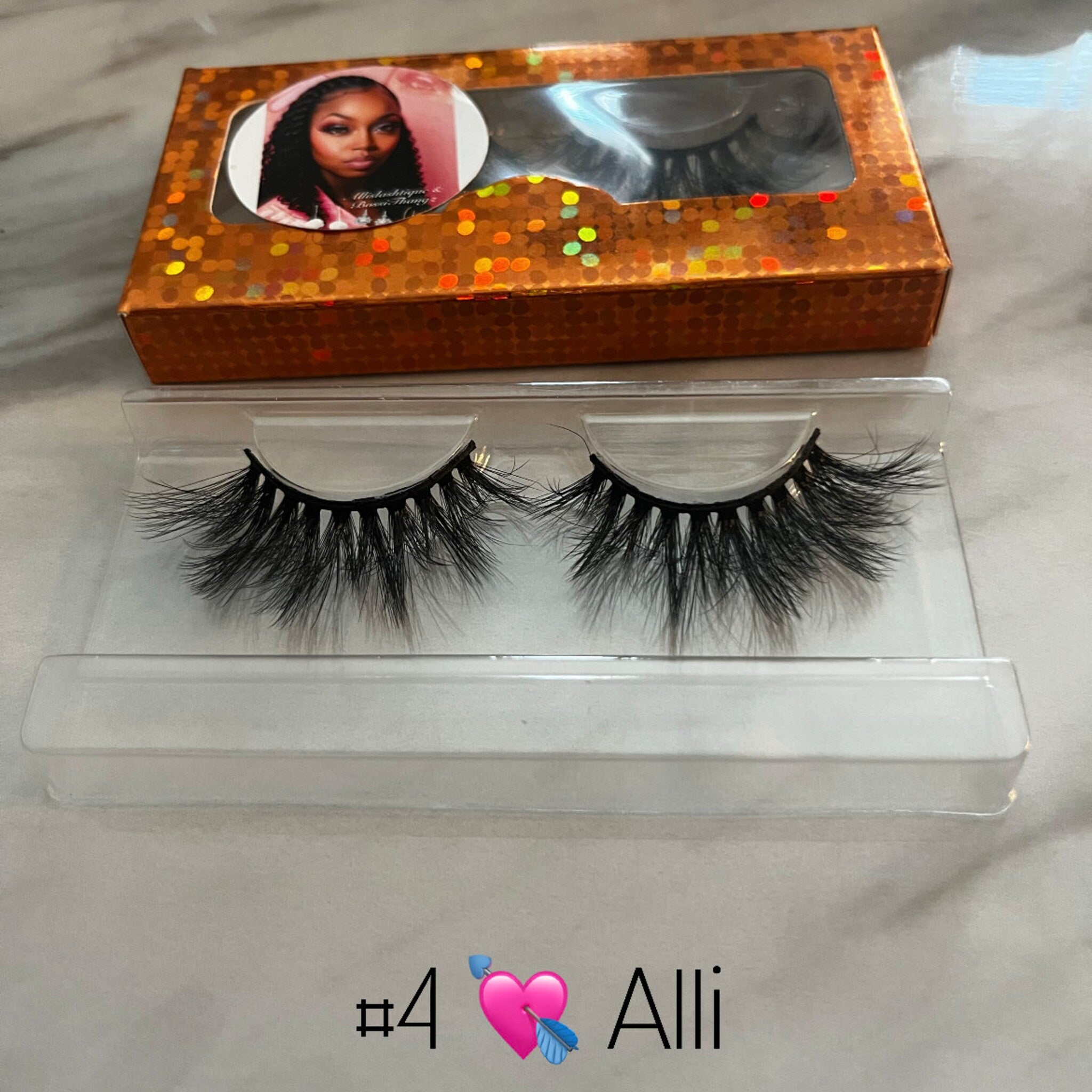 Eyelashes black faux lash set in clear plastic tray with gold box packaging